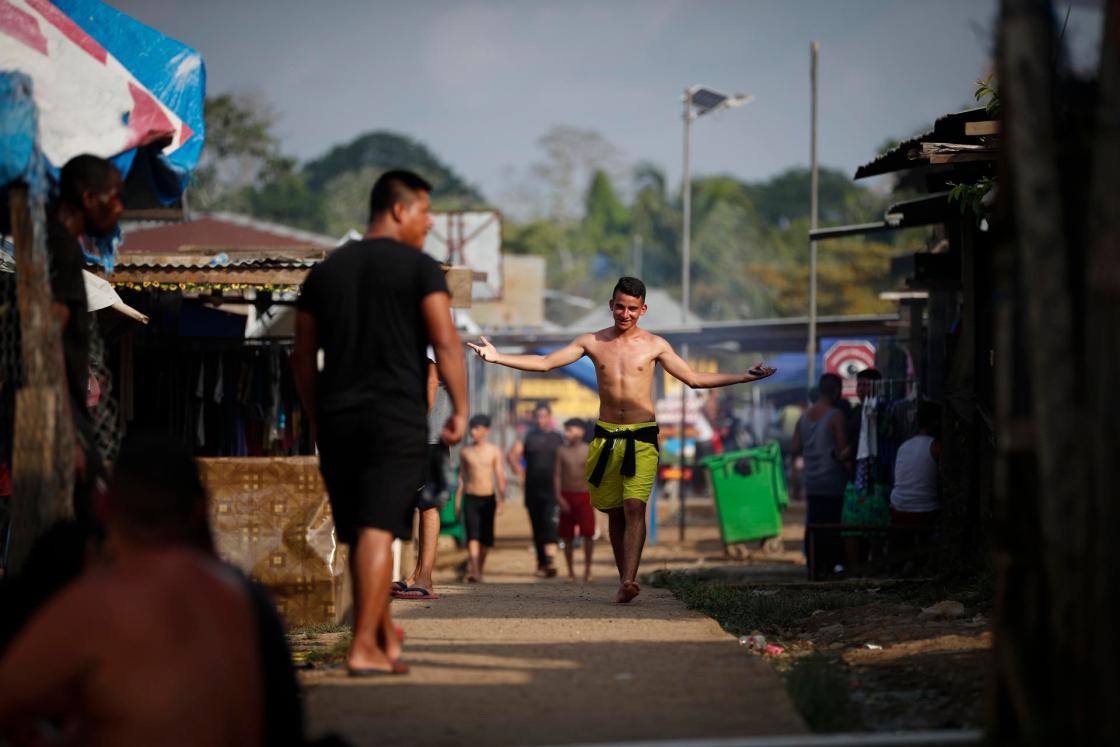 BAJO CHIQUITO (PANAMA), 15/05/2024.- A migrant waits to be registered by immigration after walking for several days through the Darién jungle towards the United States, on April 9, 2024, in Bajo Chiquito (Panama). For the LGTBIQ+ community, the migration route to the United States represents not only an escape from poverty to improve family economies but also a quest for the freedom to express themselves without hiding from attacks, persecution, and ridicule in their home countries. EFE/ Bienvenido Velasco