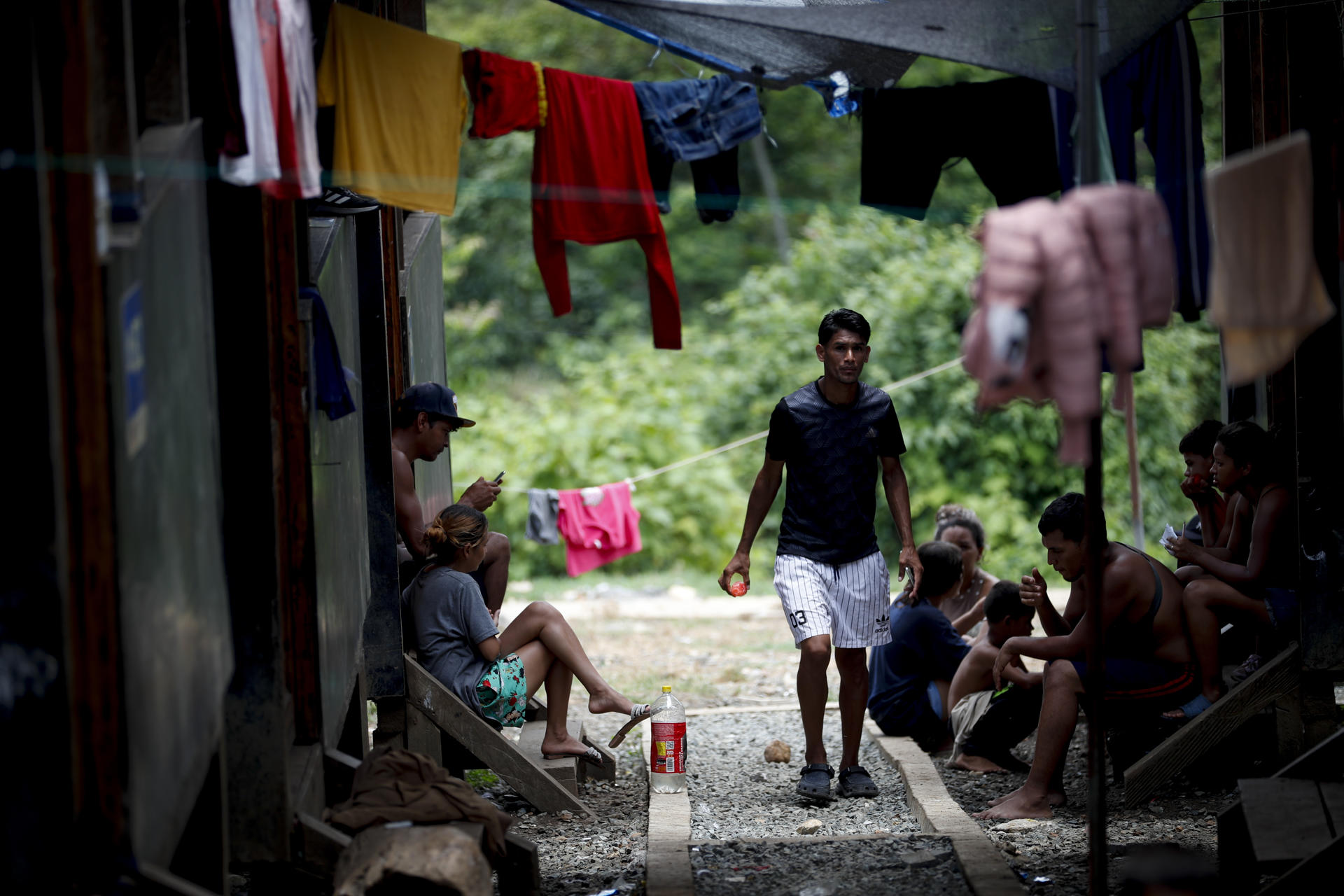 BAJO CHIQUITO (PANAMA), 14/05/2024 - Migrants rest at the Lajas Blancas migration reception station after walking for several days through the Darién jungle on their way to the United States. They flee from wars, ethnic or religious persecution, and extreme poverty, but unlike other migrants on their route through Latin America toward the United States, extracontinental migrants do not speak the language and lack the protection of a group; they are alone. EFE/Bienvenido Velasco