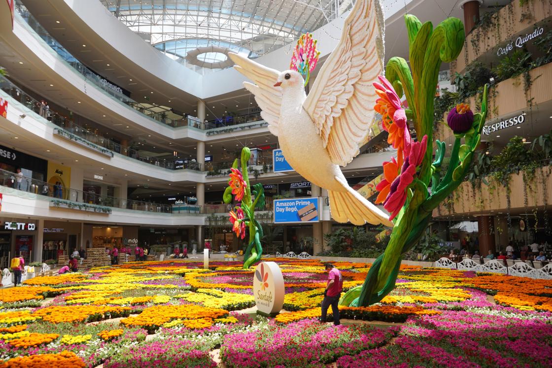 Photograph of a dove above a flower tapestry on Thursday at the Santafé Shopping Centre in Medellín, Colombia. EFE/Pablo R. Seco
